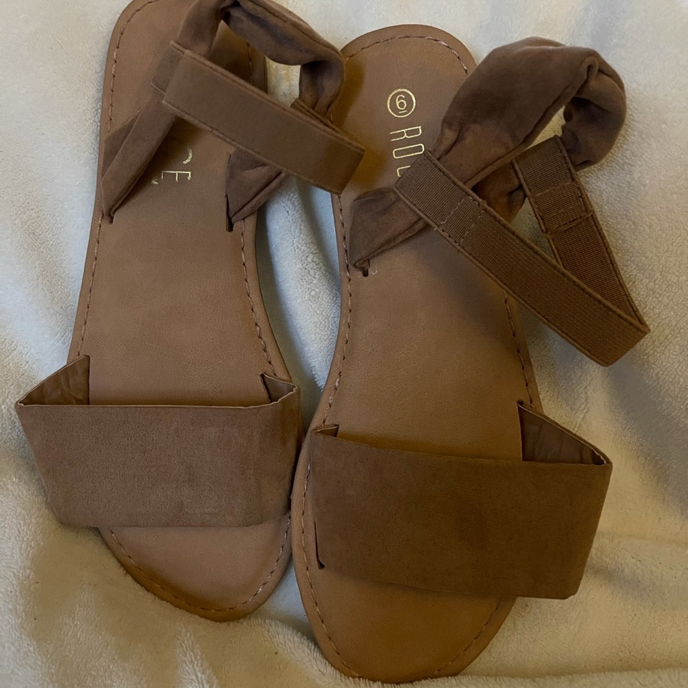 A beige pair of sandals